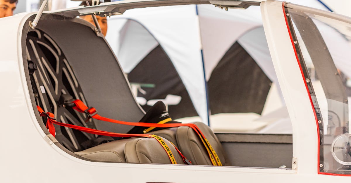 close up of an experimental aircraft s interior with an open canopy and seat harness